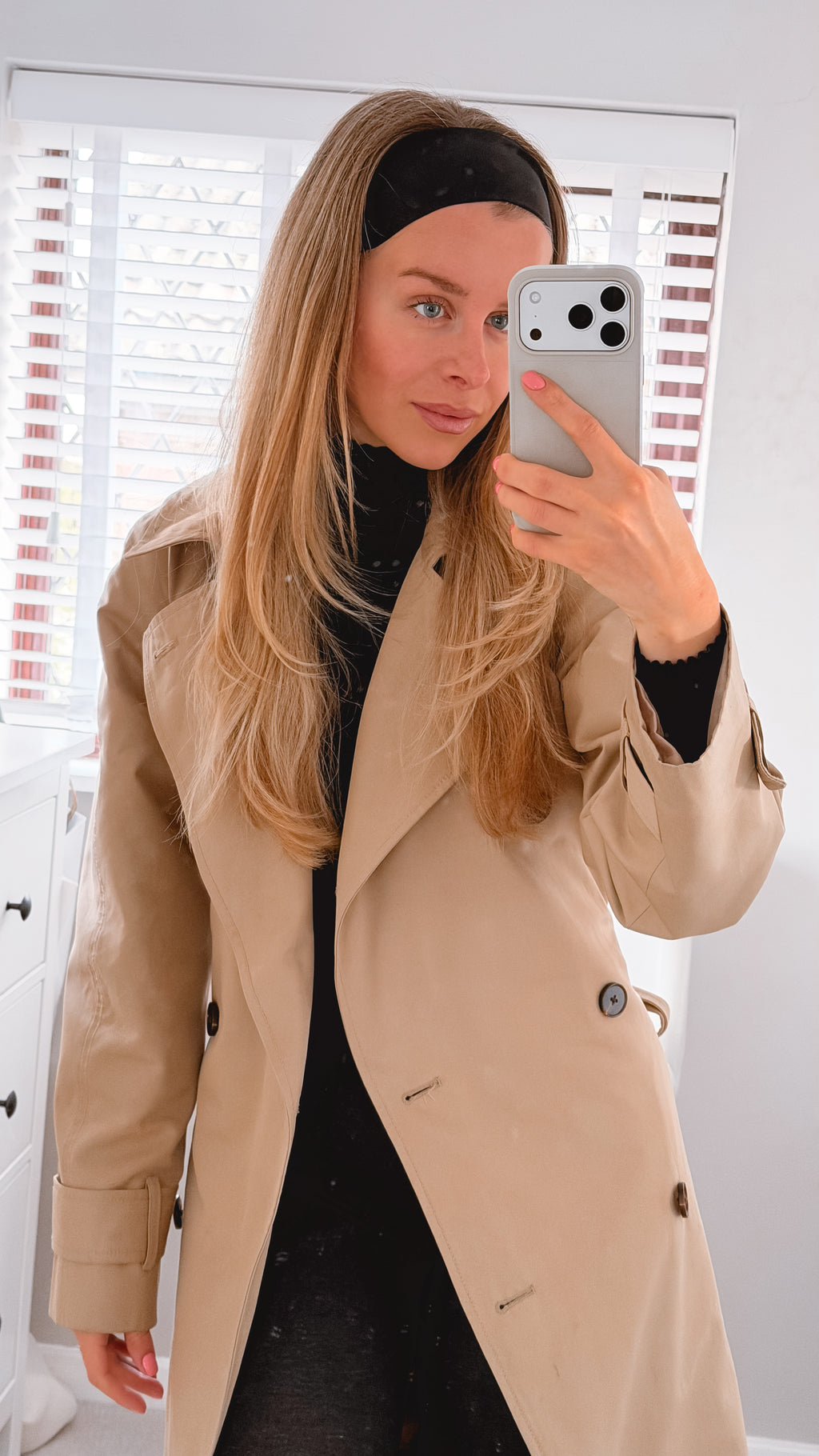 Woman in coat with headband